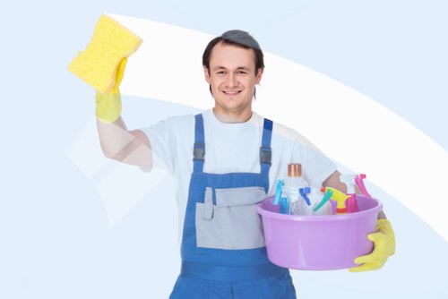Technician preparing carpet cleaning equipment for a booked service