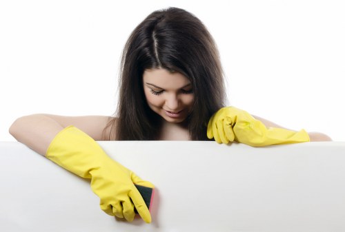 Professional cleaner tidying a central London flat in Soho